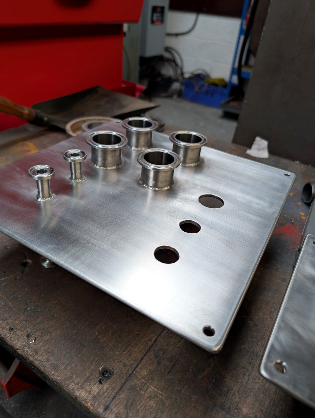 Machined plate with turned collars fitted