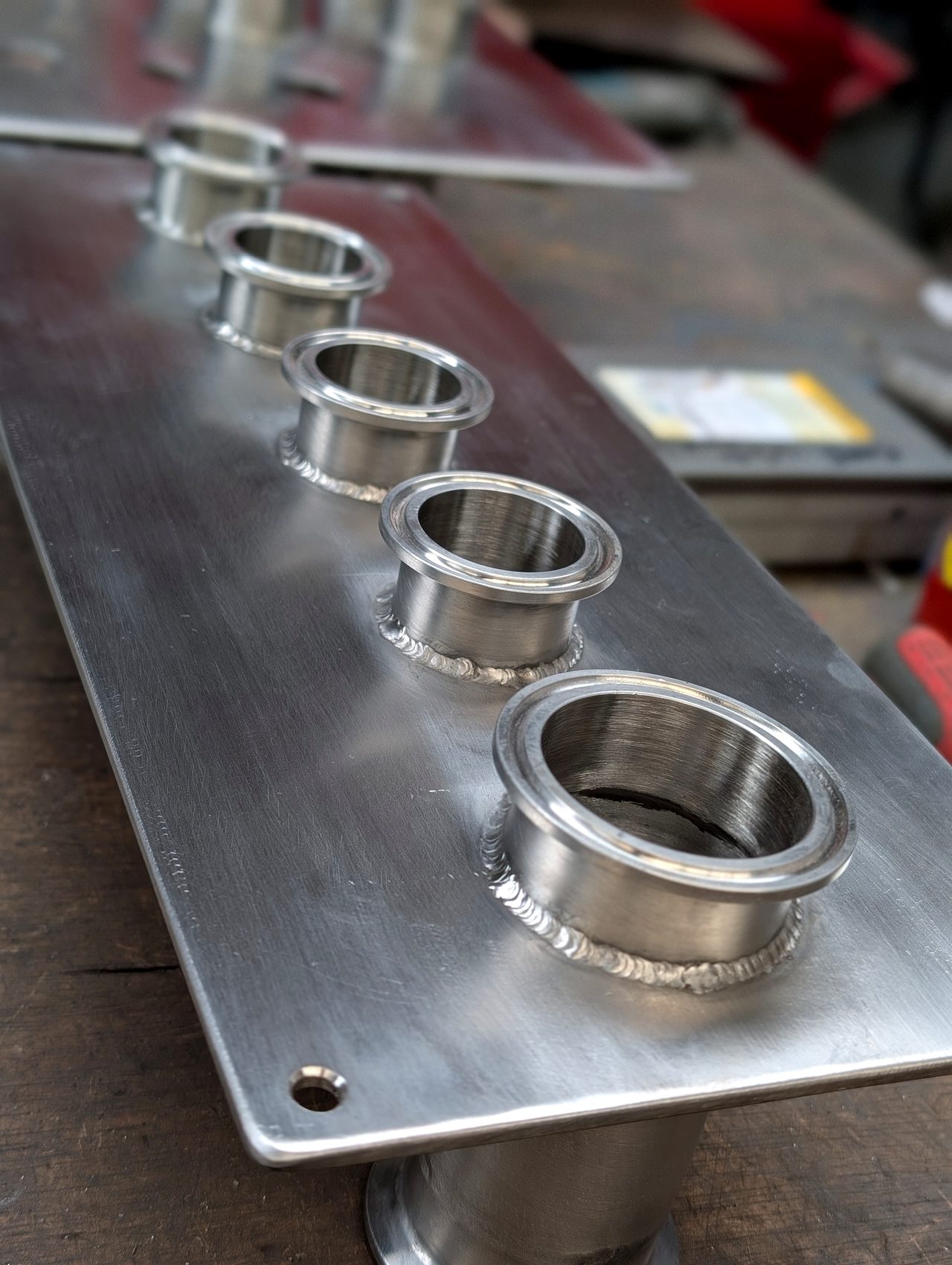 Close-up of fitted collars on a metal plate