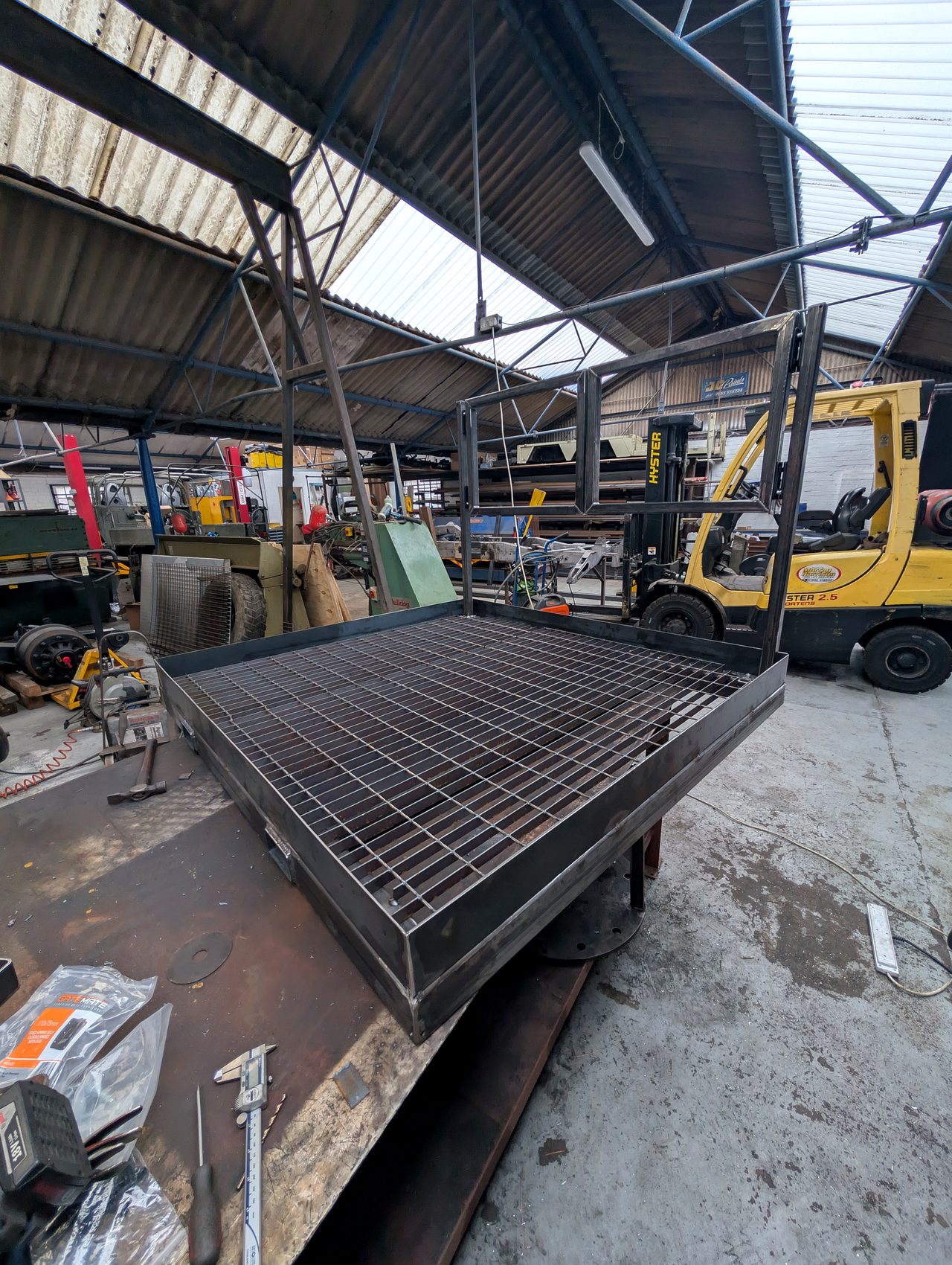Welded platform frame with steel mesh deck