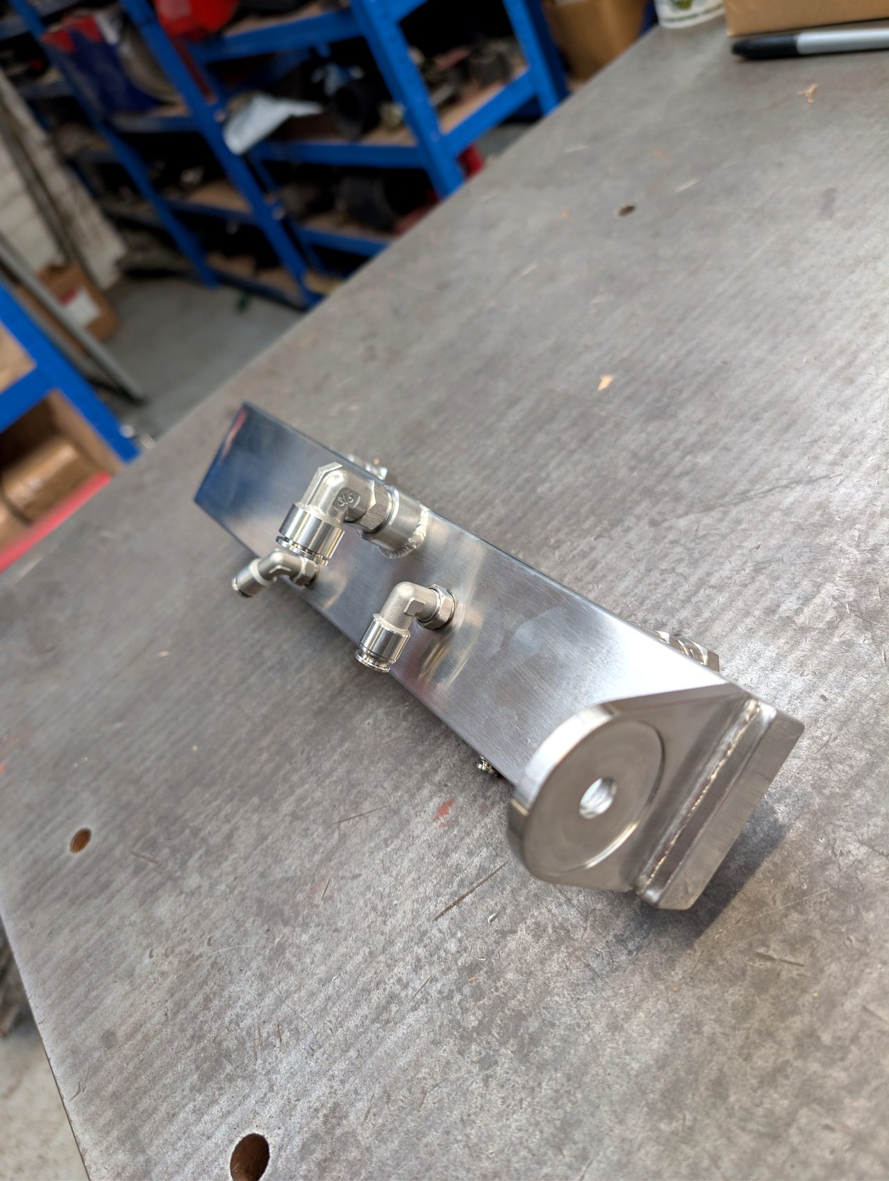 Small fabricated stainless bracket assembly