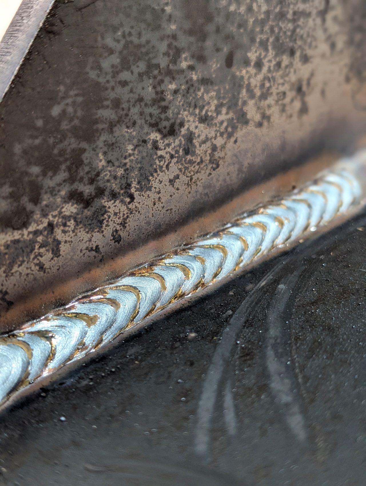 Close-up of a neat weld bead on steel