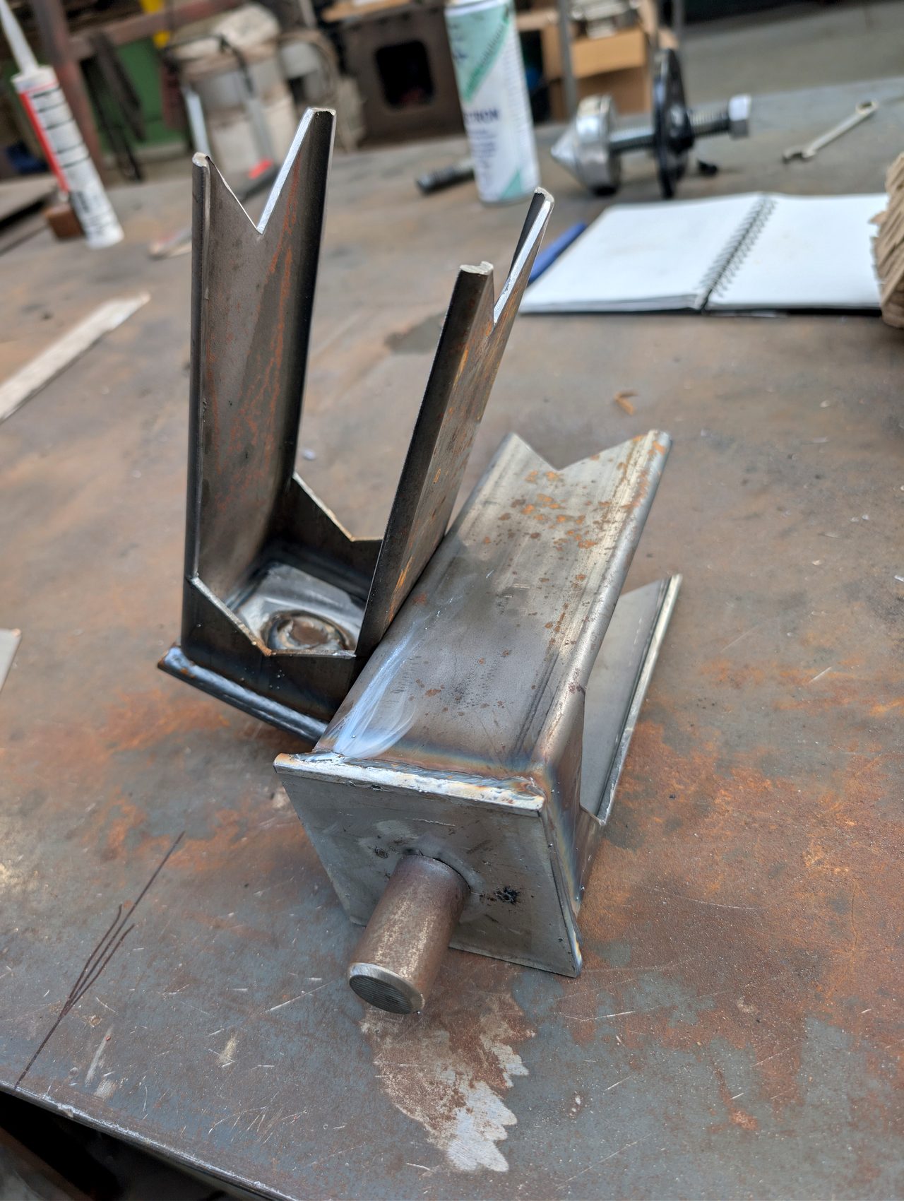 Fabricated steel bracket on a workbench